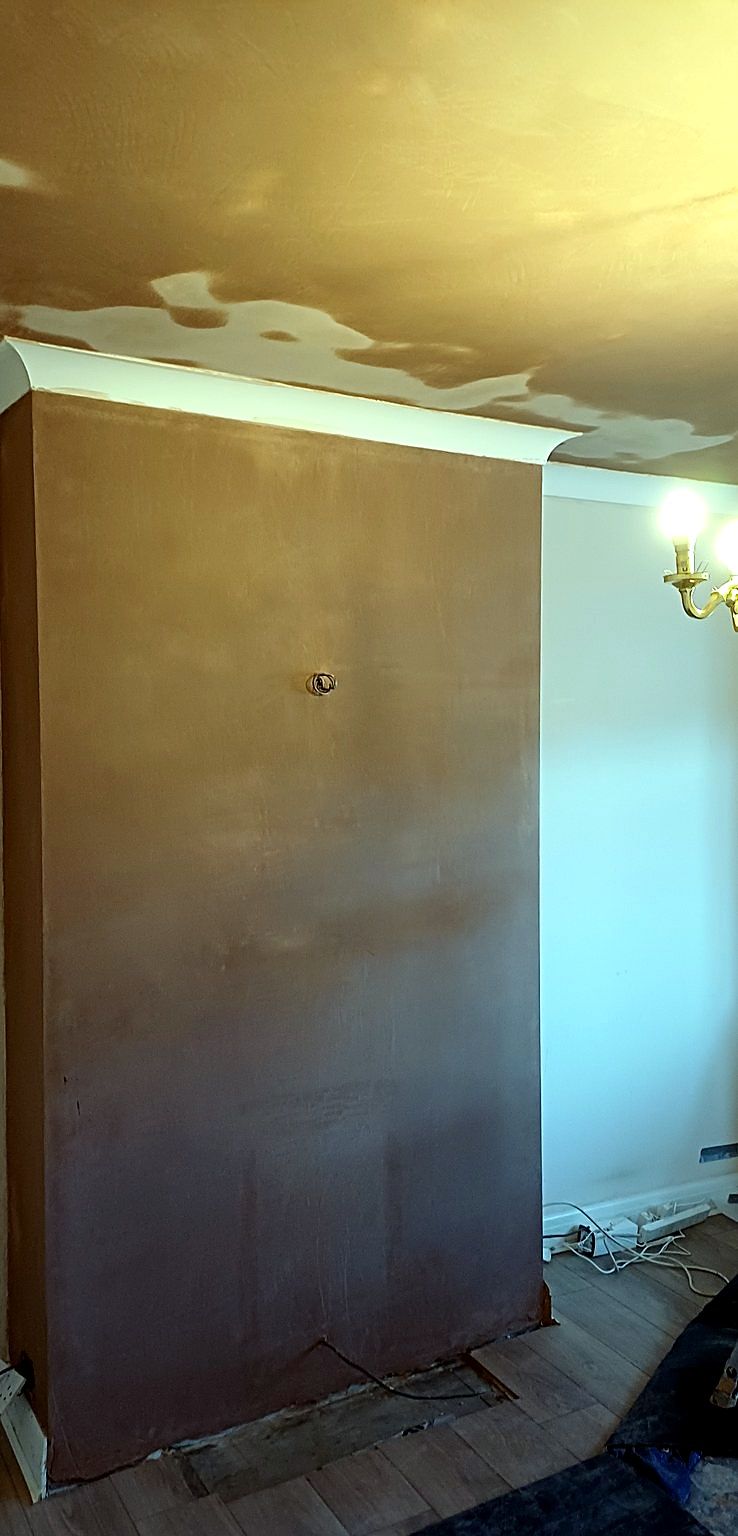 A chimney breast, skimmed and drying